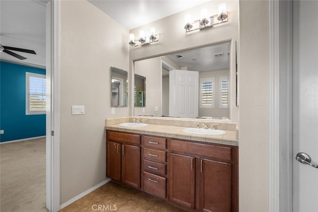 bathroom featuring tile patterned floors, plenty of natural light, ceiling fan, and vanity