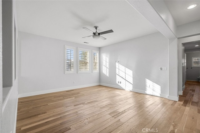 empty room featuring ceiling fan and light wood-type flooring