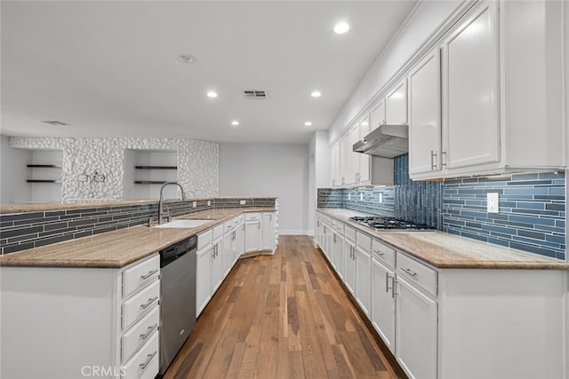 kitchen with hardwood / wood-style flooring, sink, white cabinetry, and stainless steel appliances