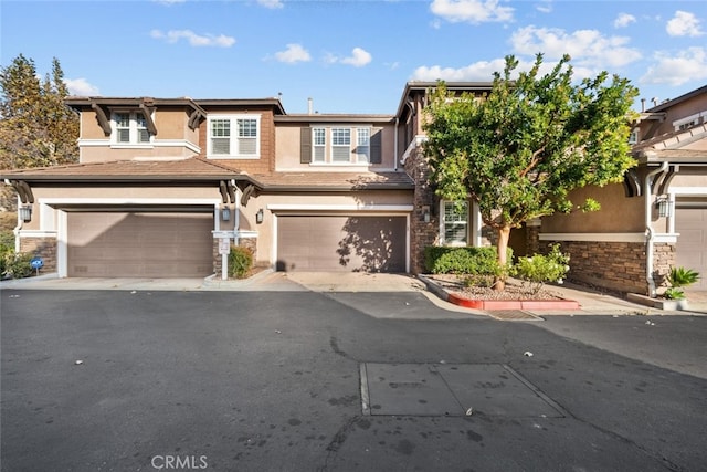 view of front of property with a garage