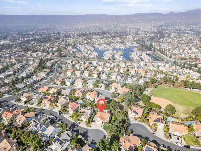 aerial view featuring a water and mountain view