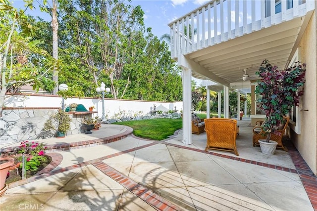 view of patio / terrace featuring ceiling fan and an outdoor living space