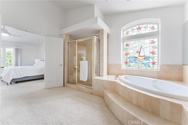 bathroom featuring shower with separate bathtub and ceiling fan