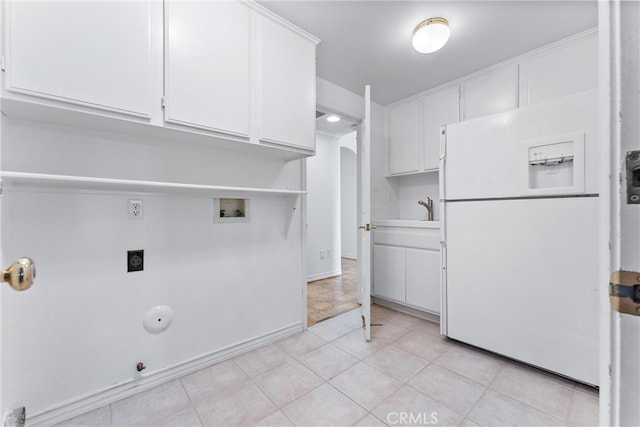 clothes washing area featuring hookup for a washing machine, gas dryer hookup, electric dryer hookup, sink, and light tile patterned flooring