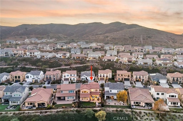 aerial view at dusk with a mountain view