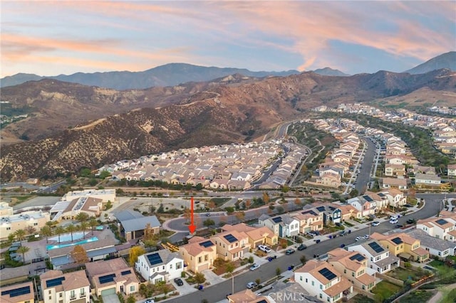 aerial view at dusk with a mountain view