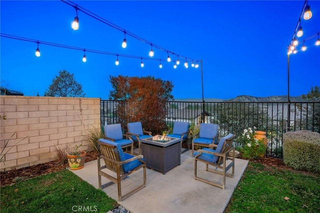 patio terrace at dusk with an outdoor fire pit