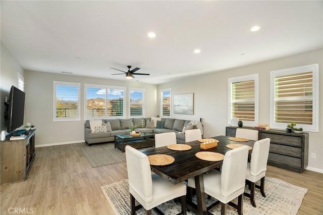 dining space featuring a wealth of natural light, ceiling fan, and light hardwood / wood-style floors