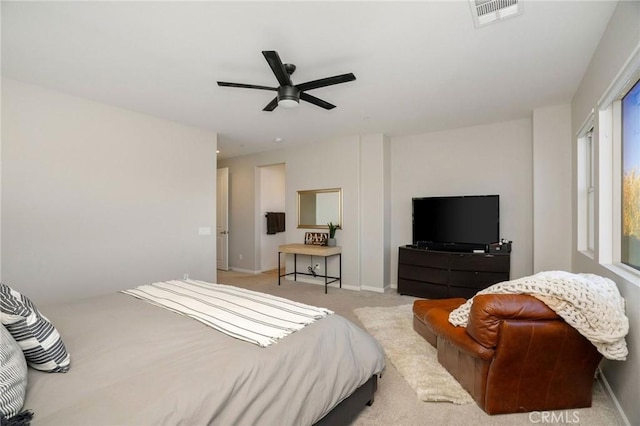 bedroom featuring ceiling fan and light colored carpet