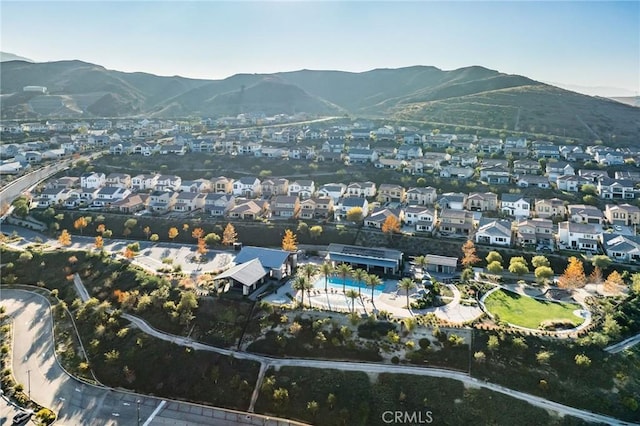 birds eye view of property featuring a mountain view