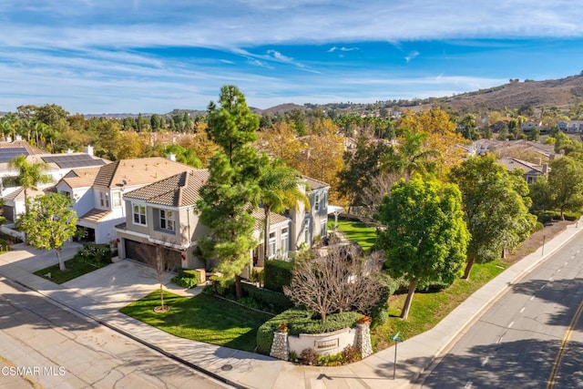 birds eye view of property with a mountain view