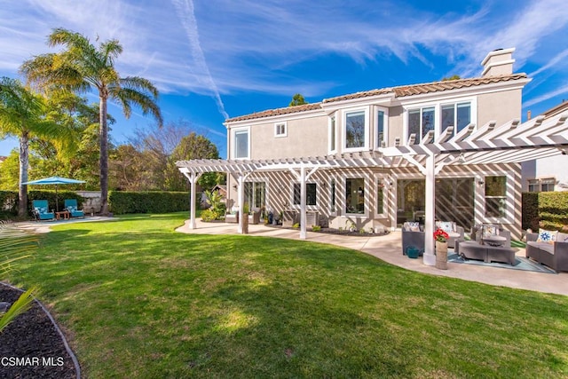 rear view of property featuring a yard, an outdoor hangout area, a pergola, and a patio area