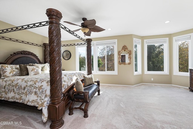 carpeted bedroom featuring ceiling fan