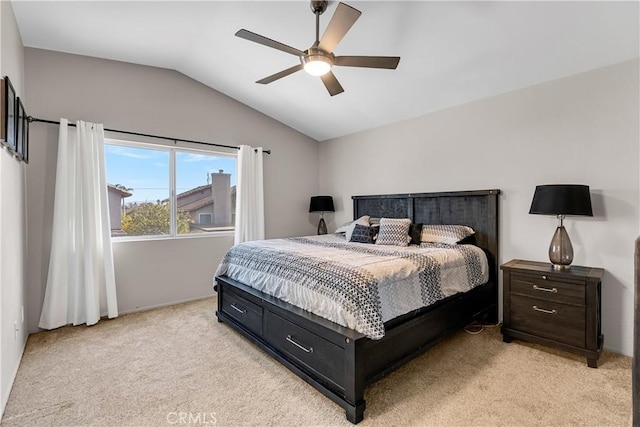 bedroom with ceiling fan, lofted ceiling, and light carpet