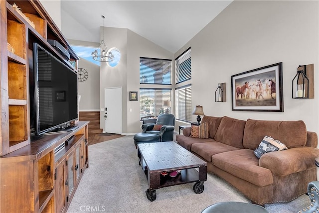 living room featuring a chandelier and high vaulted ceiling