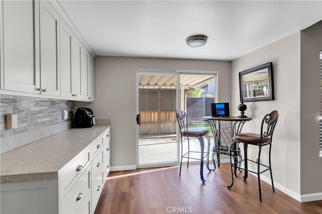 dining area featuring dark hardwood / wood-style floors