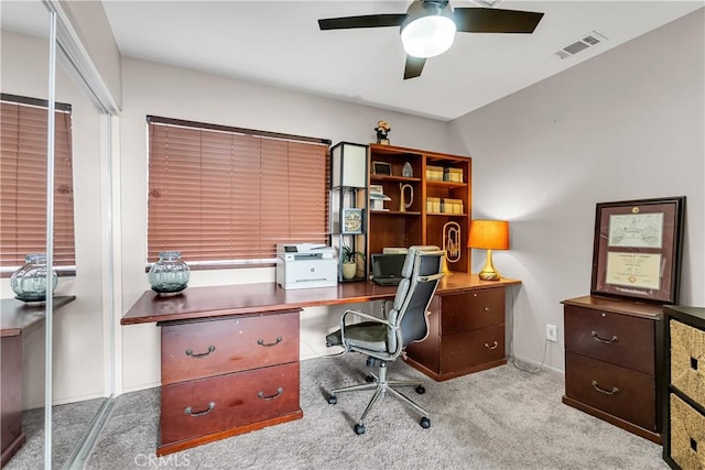 office area featuring ceiling fan and light colored carpet