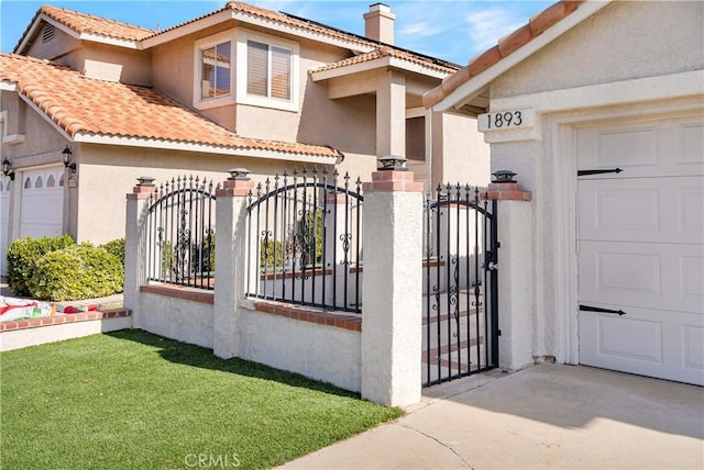 view of gate featuring a garage