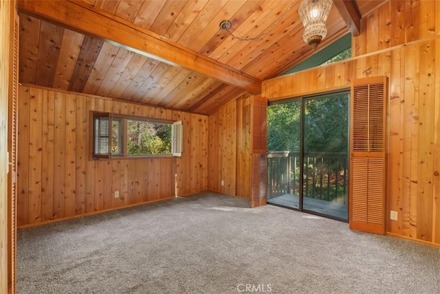 interior space with carpet floors, lofted ceiling with beams, wooden walls, and wood ceiling