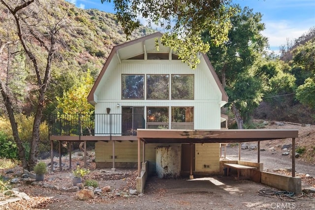 rear view of property with a deck