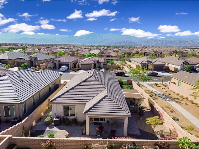 birds eye view of property featuring a mountain view