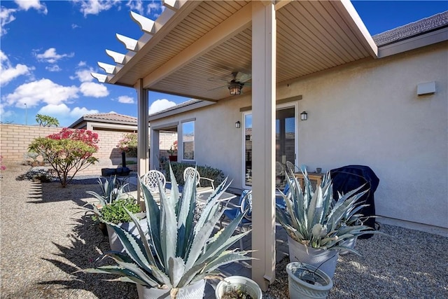 view of patio featuring ceiling fan