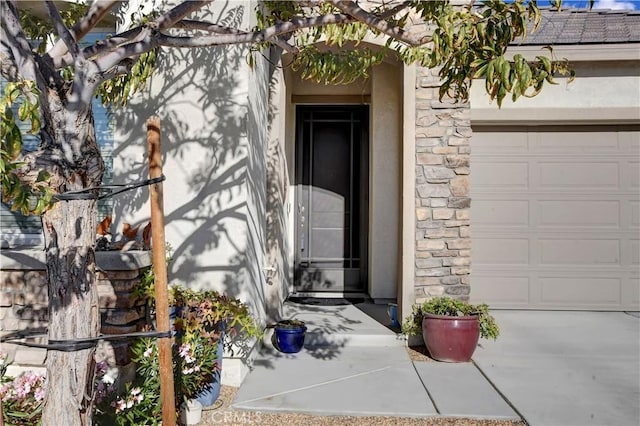 doorway to property featuring a garage