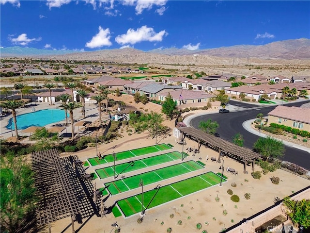 birds eye view of property featuring a mountain view