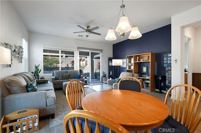 dining area featuring ceiling fan and dark hardwood / wood-style flooring