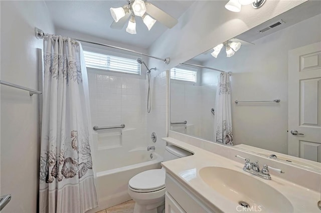 full bathroom featuring tile patterned flooring, vanity, toilet, and shower / tub combo with curtain