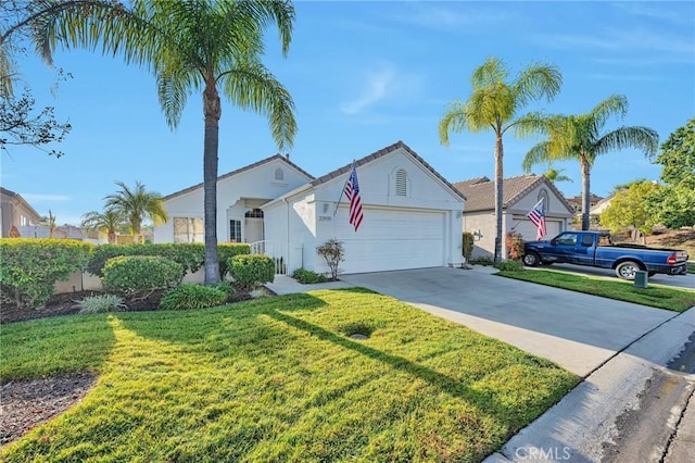 view of front of house featuring a garage and a front lawn