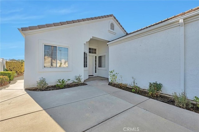 property entrance with a patio area