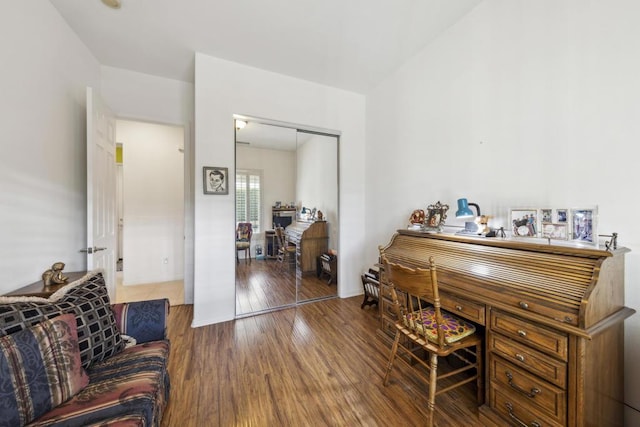 home office with dark hardwood / wood-style floors