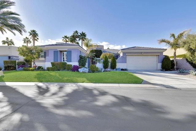 view of front facade featuring a garage and a front lawn