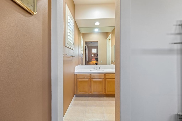 bathroom with vanity and tile patterned floors