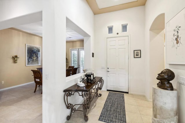 foyer entrance featuring light tile patterned floors