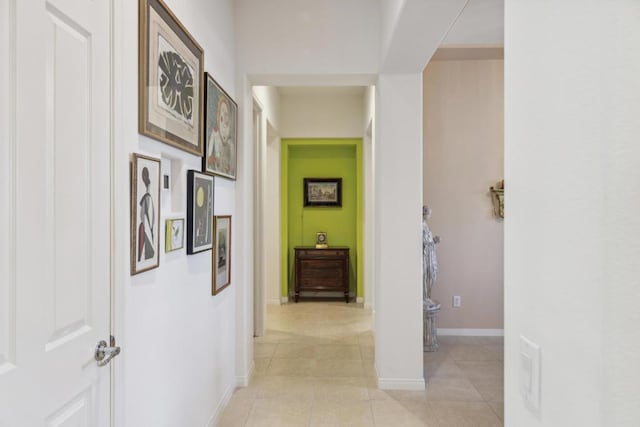 hall featuring light tile patterned floors