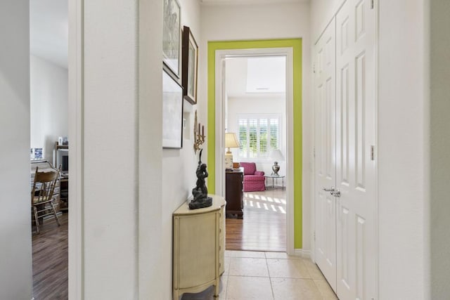 corridor with light hardwood / wood-style flooring