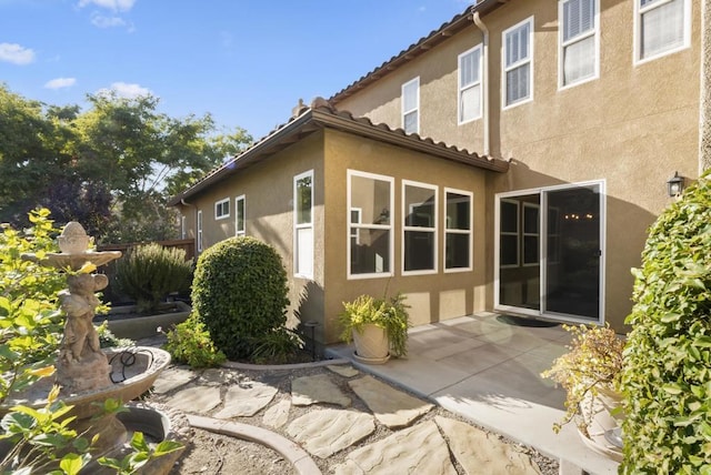 view of home's exterior featuring a patio area