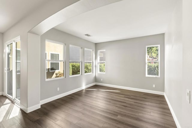 spare room featuring dark hardwood / wood-style floors