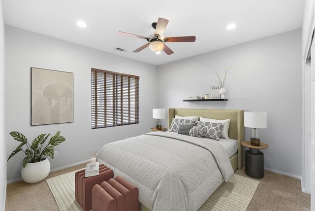 bedroom with light colored carpet and ceiling fan