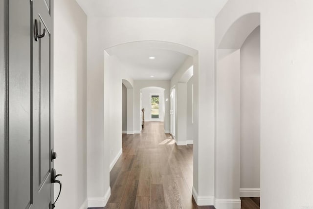 hallway with dark wood-type flooring