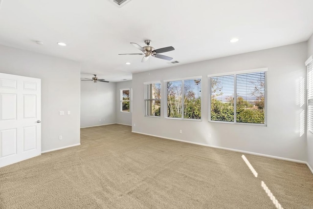 unfurnished room featuring carpet flooring and ceiling fan