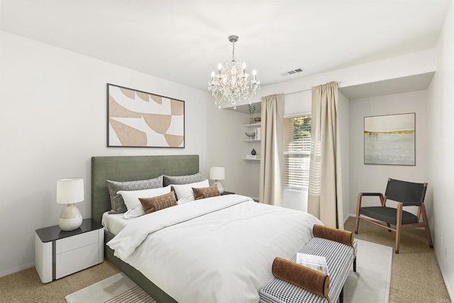 carpeted bedroom with a notable chandelier