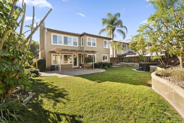 rear view of house featuring a pergola, a yard, and a patio