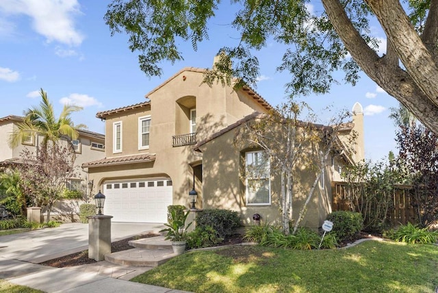 mediterranean / spanish house with a garage