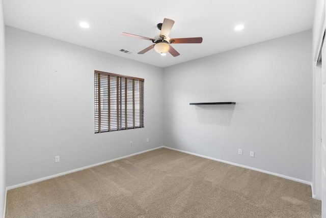 empty room featuring carpet and ceiling fan