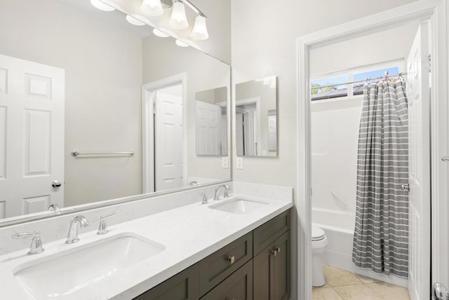 full bathroom featuring toilet, tile patterned flooring, vanity, and shower / tub combo with curtain