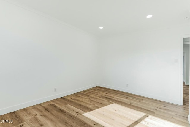 spare room with light hardwood / wood-style floors