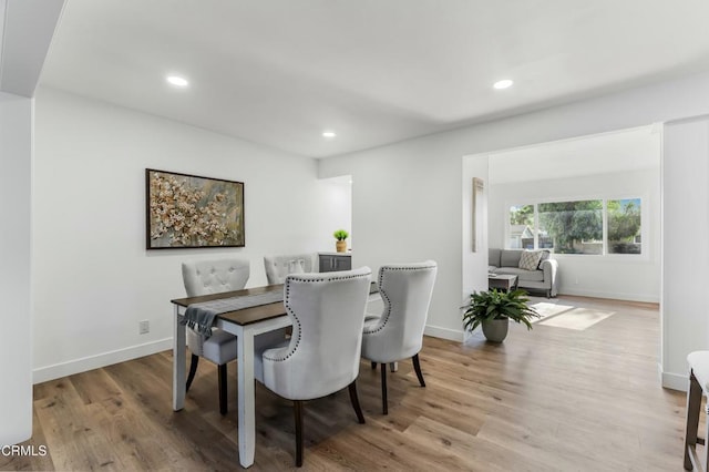 dining space featuring light wood-type flooring